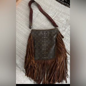 Made from LV handbag. Can be worn as crossbody or shoulder bag.
